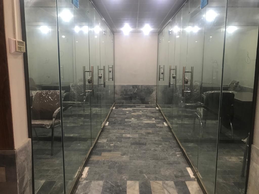 Corridor lined with glass-fronted offices at the Shikarpur branch