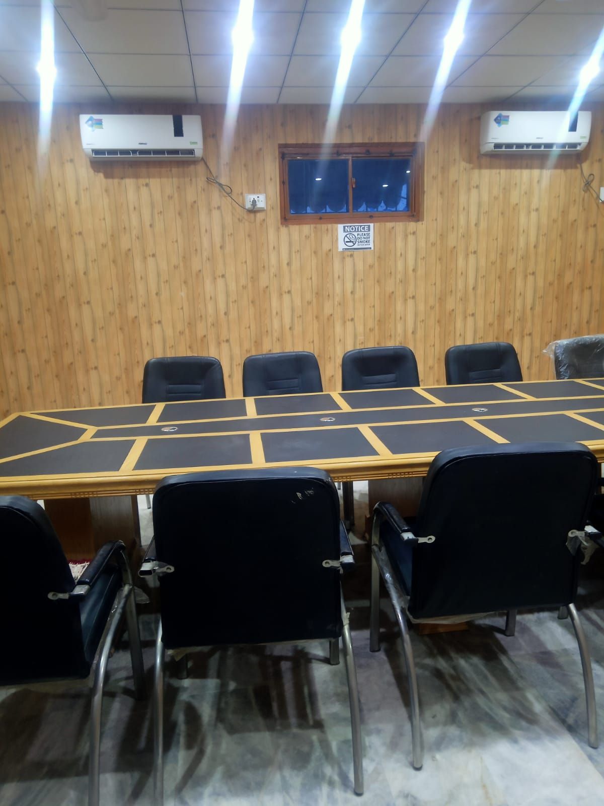 Air-conditioned conference room with timber-panelled walls at the Sukkur branch